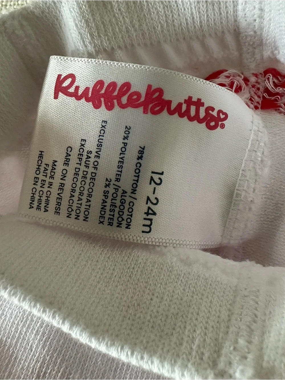 Rufflebutts White Baby/Toddler Footed Tights with Red Bow Pattern